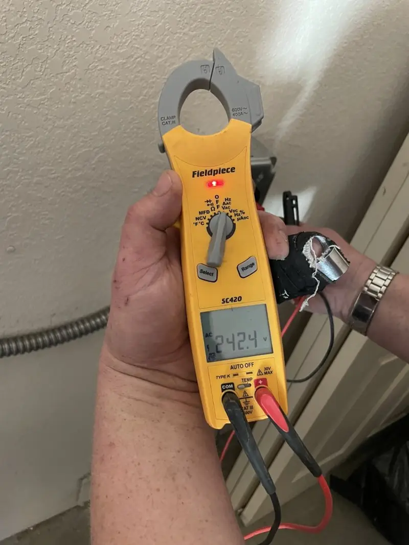 Voltage testing with clamp meter during Electrical Installation Services in North Hudson